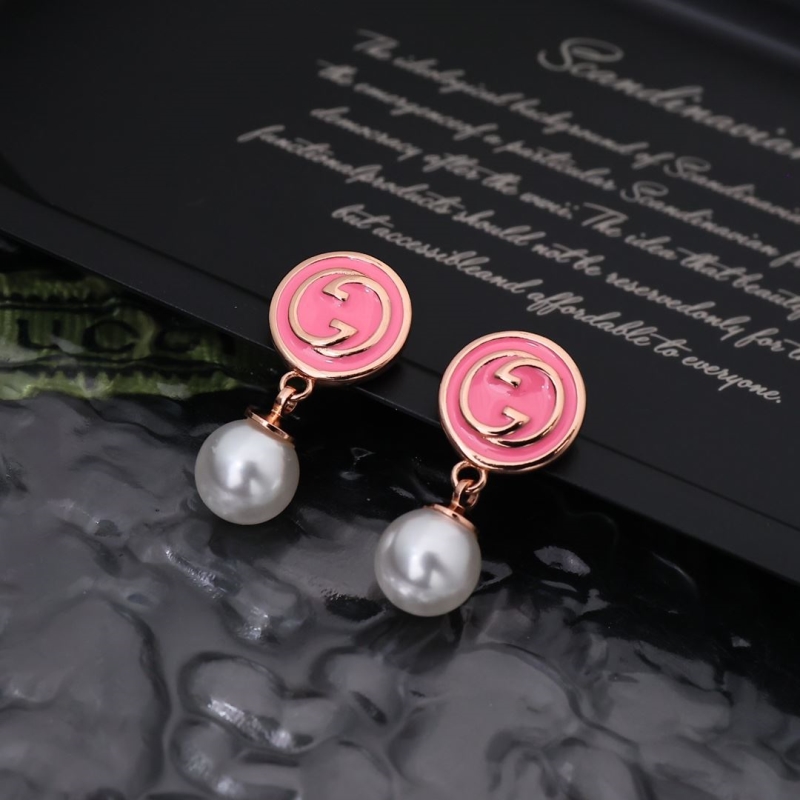 G*u*i earrings